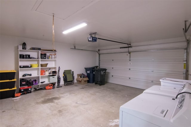 garage featuring a garage door opener and independent washer and dryer