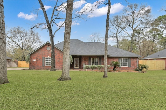 single story home with a front lawn