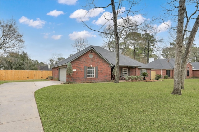 ranch-style home featuring a garage and a front lawn