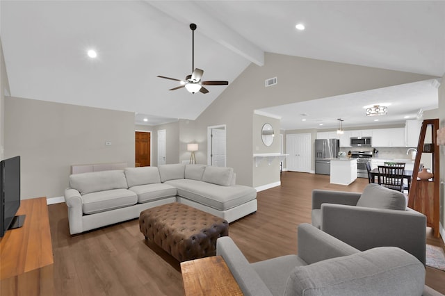 living room featuring dark wood-type flooring, ceiling fan, high vaulted ceiling, and beamed ceiling