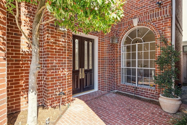 entrance to property with a patio area