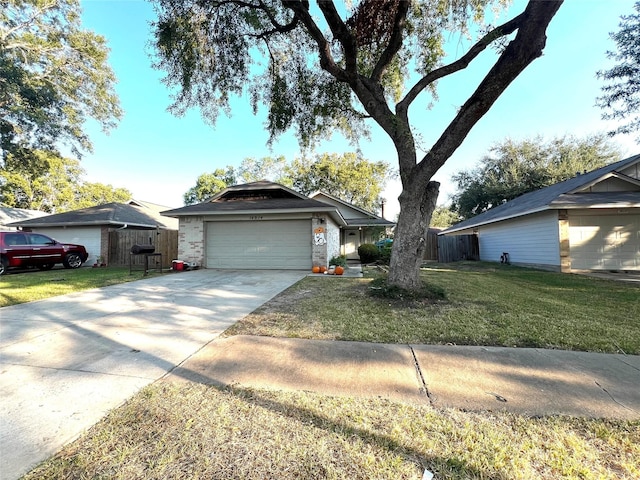 ranch-style home with a garage and a front yard