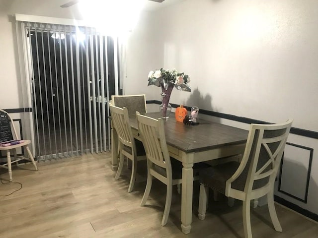 dining space with light hardwood / wood-style flooring