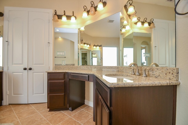 bathroom with vanity and tile patterned floors