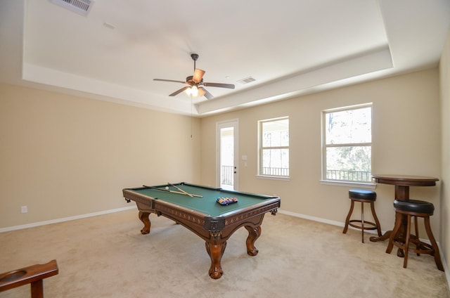 rec room with ceiling fan, billiards, a tray ceiling, and light carpet