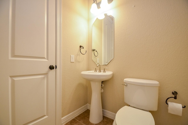 bathroom featuring tile patterned floors and toilet