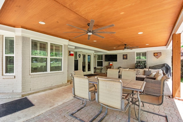 view of patio / terrace featuring an outdoor hangout area, ceiling fan, and french doors