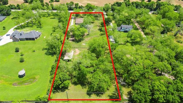 birds eye view of property with a rural view