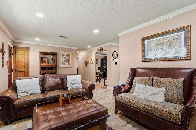 living room with ornamental molding and a textured ceiling