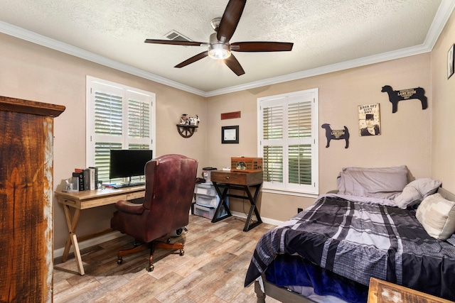 bedroom featuring crown molding, ceiling fan, light hardwood / wood-style floors, and a textured ceiling