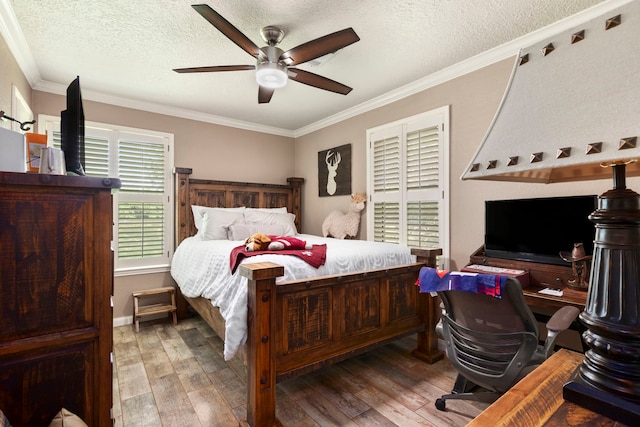 bedroom with crown molding, wood-type flooring, a textured ceiling, and ceiling fan