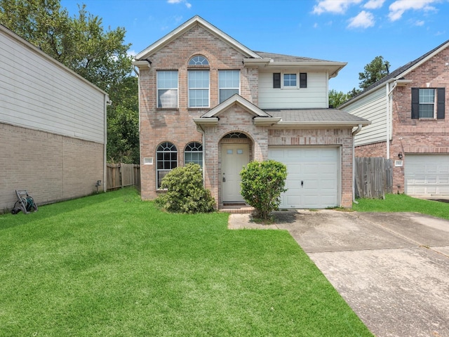 view of front of house featuring a garage and a front lawn