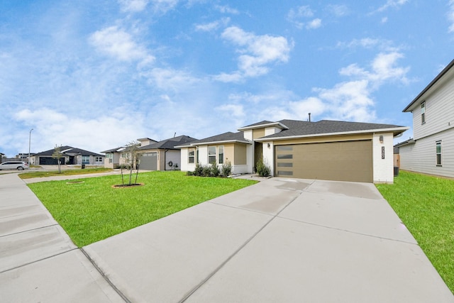 view of front of house with a garage and a front lawn