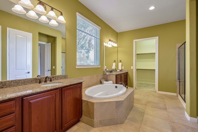 bathroom with vanity, plus walk in shower, and tile patterned flooring