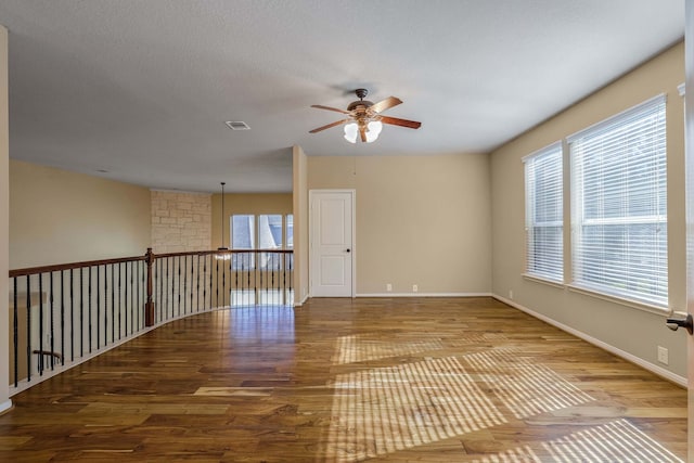 unfurnished room with ceiling fan and light wood-type flooring