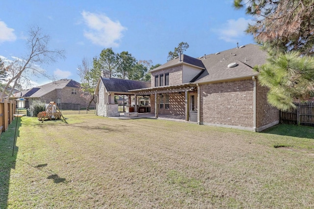 back of house with a playground, a yard, and a pergola