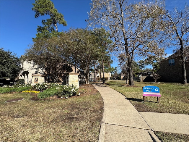 surrounding community featuring a lawn