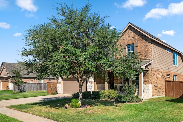 view of front of house with a garage and a front yard