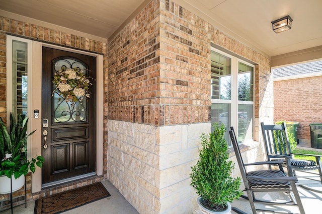 entrance to property featuring a porch