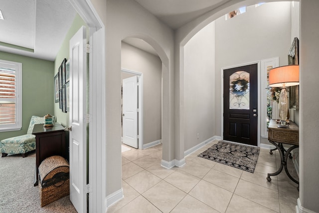 entryway with light tile patterned floors