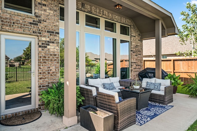 view of patio / terrace with area for grilling and outdoor lounge area