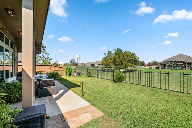 view of yard with outdoor lounge area and a patio area