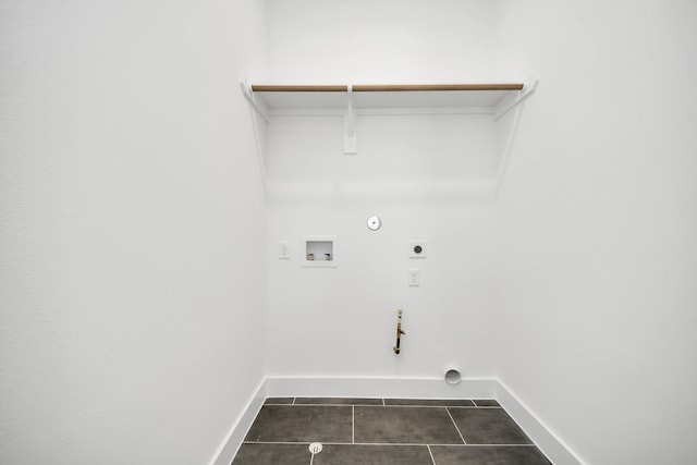 washroom featuring hookup for a washing machine, hookup for a gas dryer, hookup for an electric dryer, and dark tile patterned floors