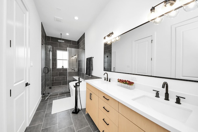 bathroom featuring tile patterned floors, vanity, and an enclosed shower