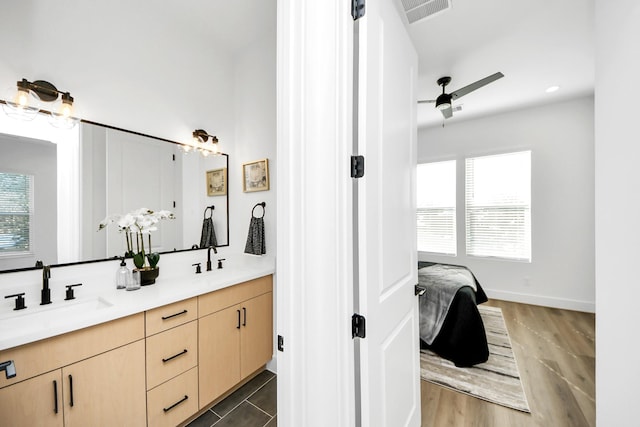 bathroom featuring vanity and ceiling fan