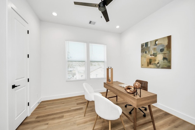 office area with ceiling fan and light hardwood / wood-style flooring