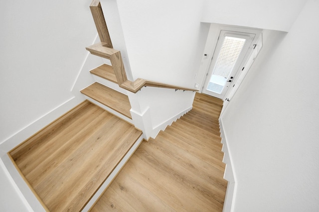 stairway with wood-type flooring