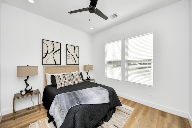 bedroom with hardwood / wood-style flooring and ceiling fan