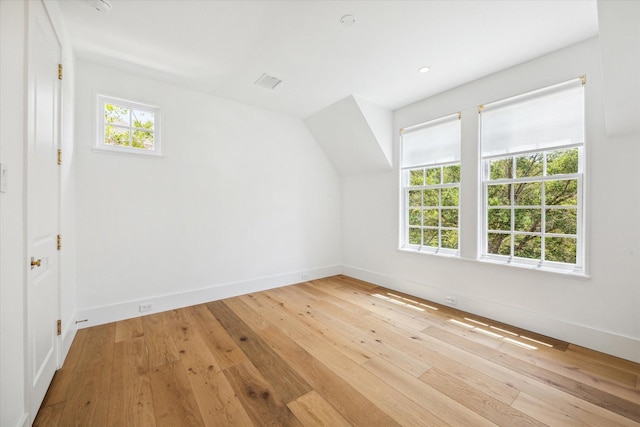 additional living space featuring light hardwood / wood-style floors