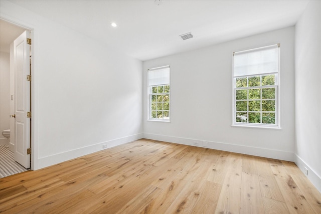 unfurnished room with light hardwood / wood-style floors