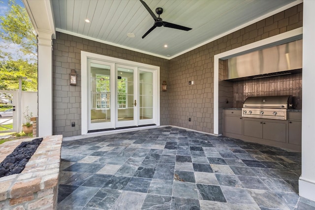 view of patio / terrace featuring area for grilling, french doors, ceiling fan, and exterior kitchen