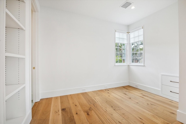 unfurnished bedroom with hardwood / wood-style flooring