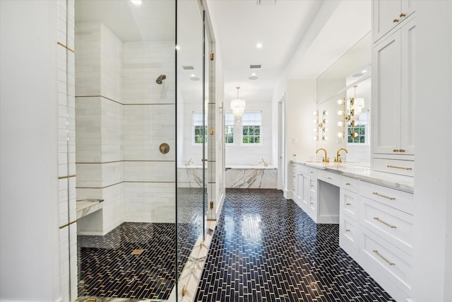 bathroom featuring tile patterned floors, independent shower and bath, and sink