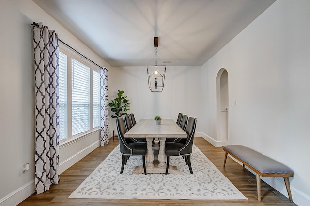 dining room with wood-type flooring