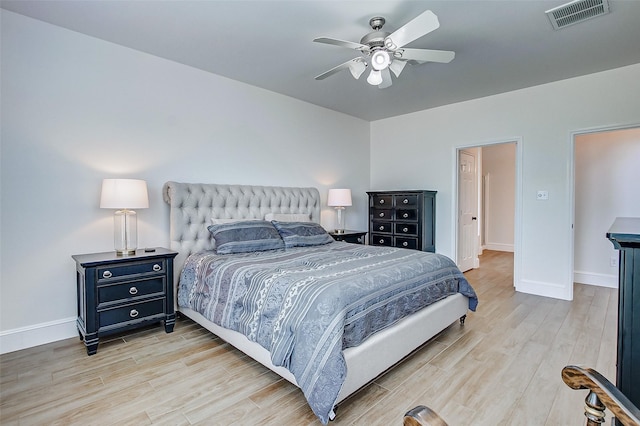 bedroom with ceiling fan and light wood-type flooring