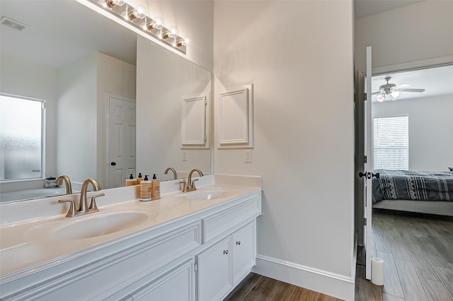 bathroom with vanity, wood-type flooring, and ceiling fan