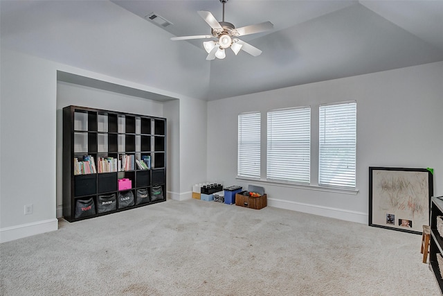 miscellaneous room with ceiling fan, light colored carpet, and lofted ceiling