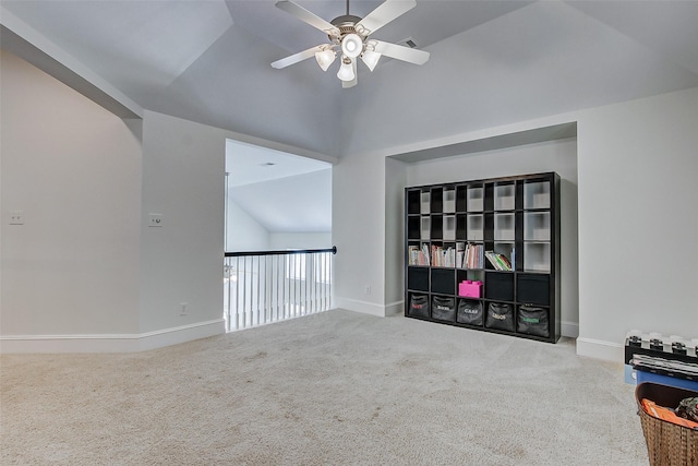 unfurnished room with vaulted ceiling, carpet floors, and ceiling fan