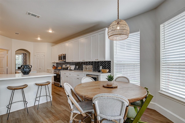 dining space featuring light hardwood / wood-style flooring