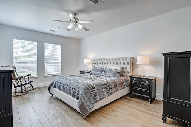 bedroom with light hardwood / wood-style flooring and ceiling fan