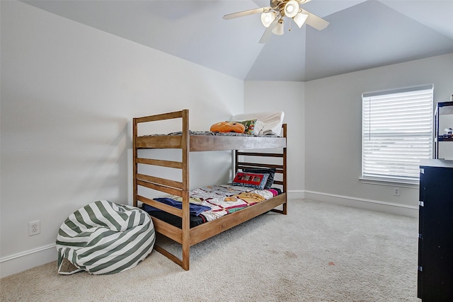 carpeted bedroom with lofted ceiling and ceiling fan