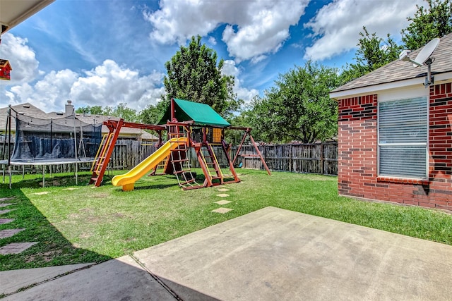 view of yard featuring a playground, a trampoline, and a patio area