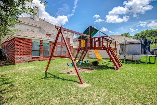 view of play area with a trampoline and a lawn