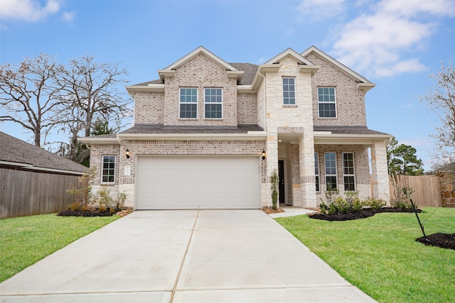 view of front facade with a garage and a front yard