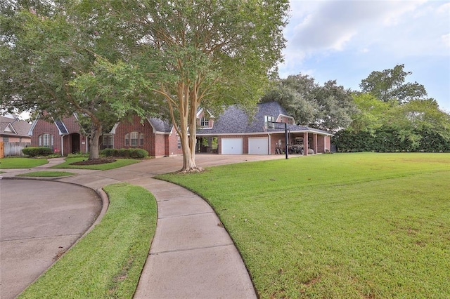 view of front of home featuring a garage and a front lawn