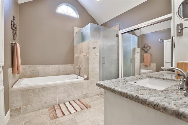 bathroom with vanity, lofted ceiling, and plus walk in shower